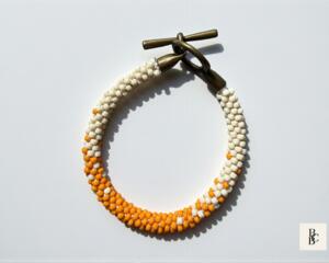 Orange Creamsicle Kumihimo bracelet with orange and ivory seed beads, handmade beaded bracelet with antique brass toggle clasp